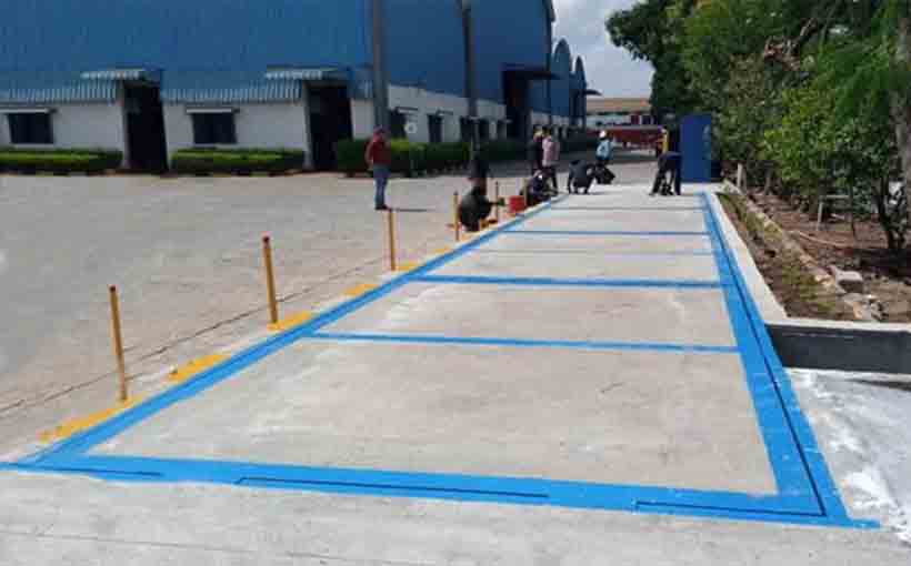 Workers at installation of the Pit Weighbridge for truck use.