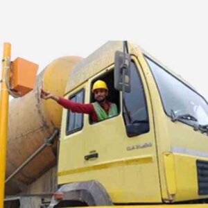 A truck driver operating an unmanned weighbridge.
