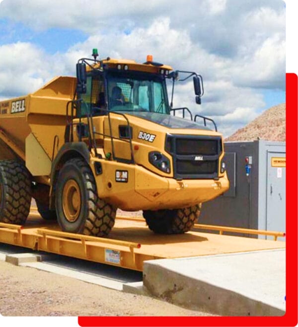A truck parked on a weighbridge platform, representing a trusted name for precision and perfection.